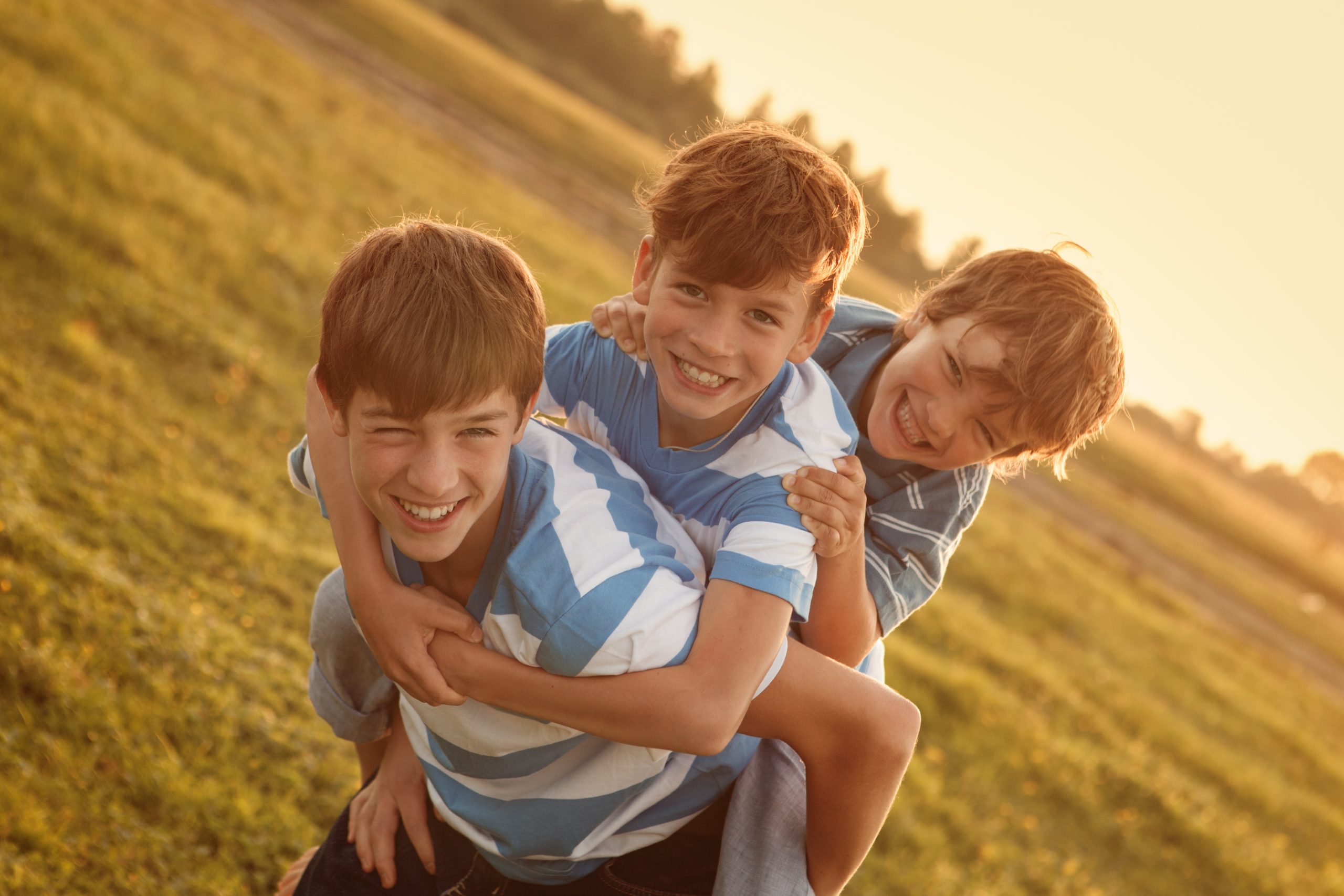 Portrait of three happy cheerful brothers